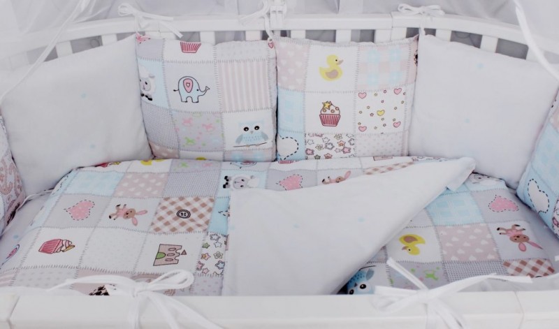 Бортики в кроватку для новорожденных — как выбрать бампер