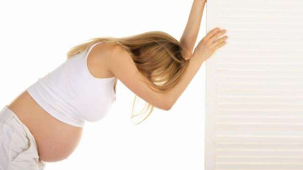 Причины боли в пояснице при беременности на раннем сроке
